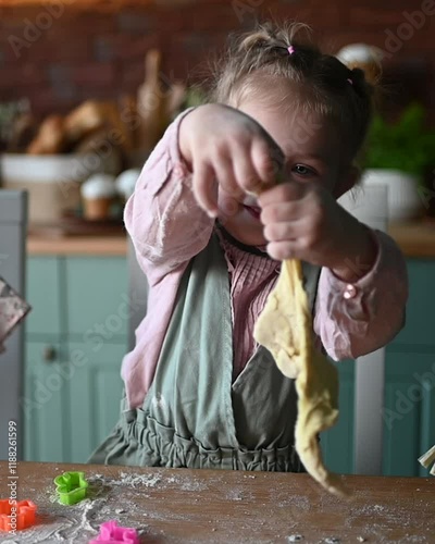 Little Girl Baking Easter Cookies in the Kitchen