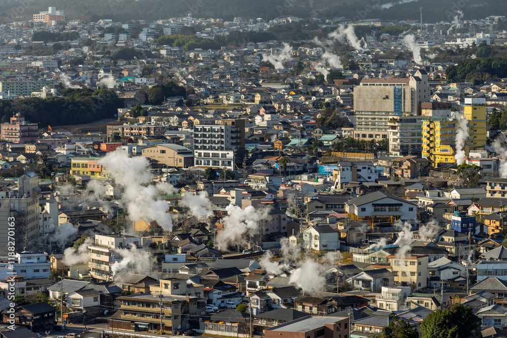 Beppu cityscape with Steam drifted from public hot spring baths and ryokan onsen background, Beppu, Oita, Kyushu, Japan.