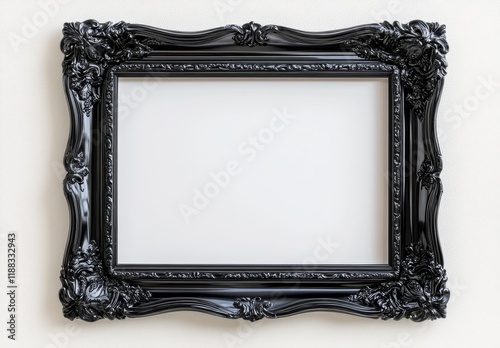 Ornate black picture frame on white wall.