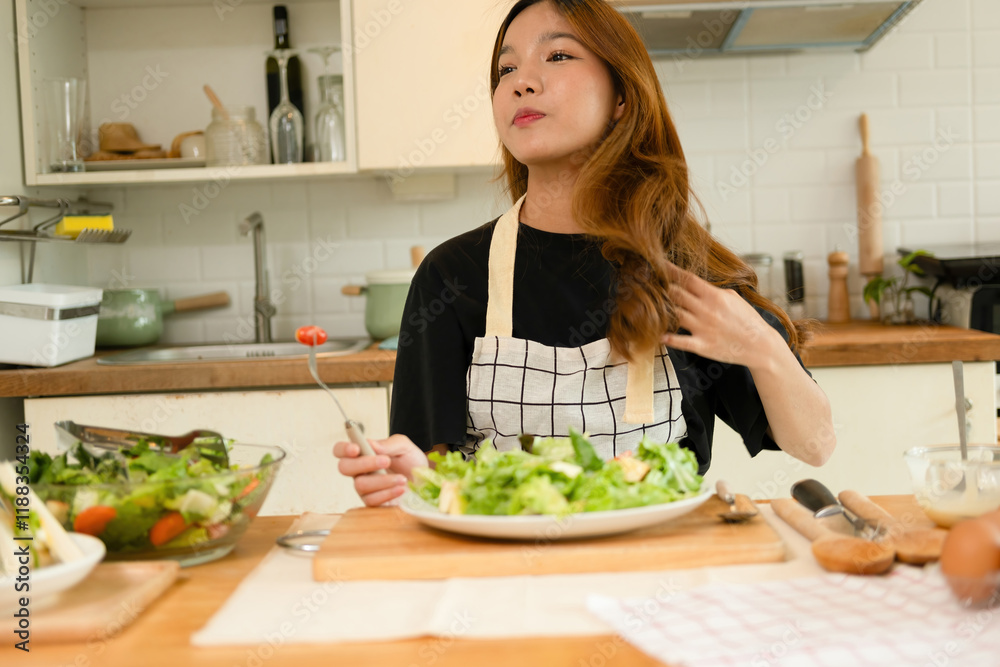A female homecook enjoying her salad A female homecook enjoying her salad