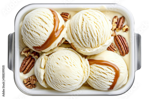 Creamy vanilla ice cream with caramel swirls and pecans in tray photo