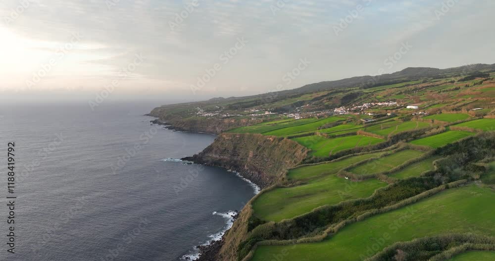 Coastal cliffs at the atlantic ocean, sunset at the Azores islands, Sao Miguel, Portugal.
