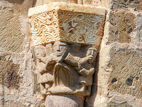 Detail of the capital of a window in the apse of the collegiate church of San Martín de Elines from the 12th century. Cantabria, Spain. photo