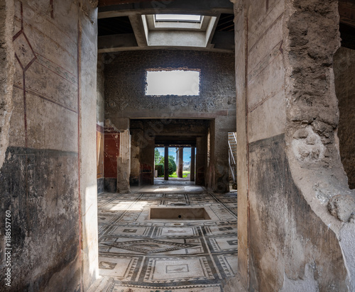 Pompei, Italy - 22 march 2024 - interior of a house with mosaic floor at the ancient Roman city photo