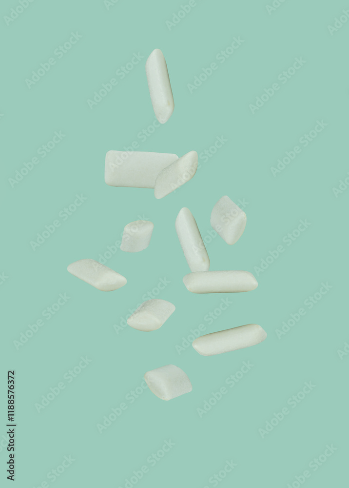 Falling mint chewing gums isolated on background, full depth of field. Falling mint chewing gums isolated on background, full depth of field.