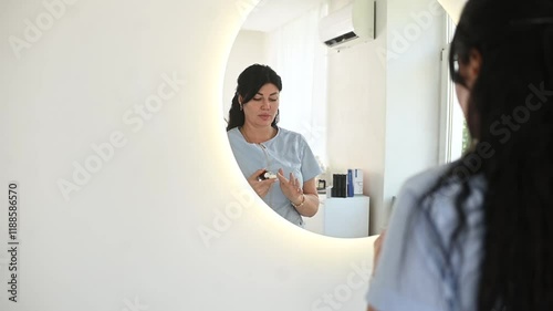 Cosmetologist Applying Skincare Cream in Front of a Mirror, Horizontal Frame