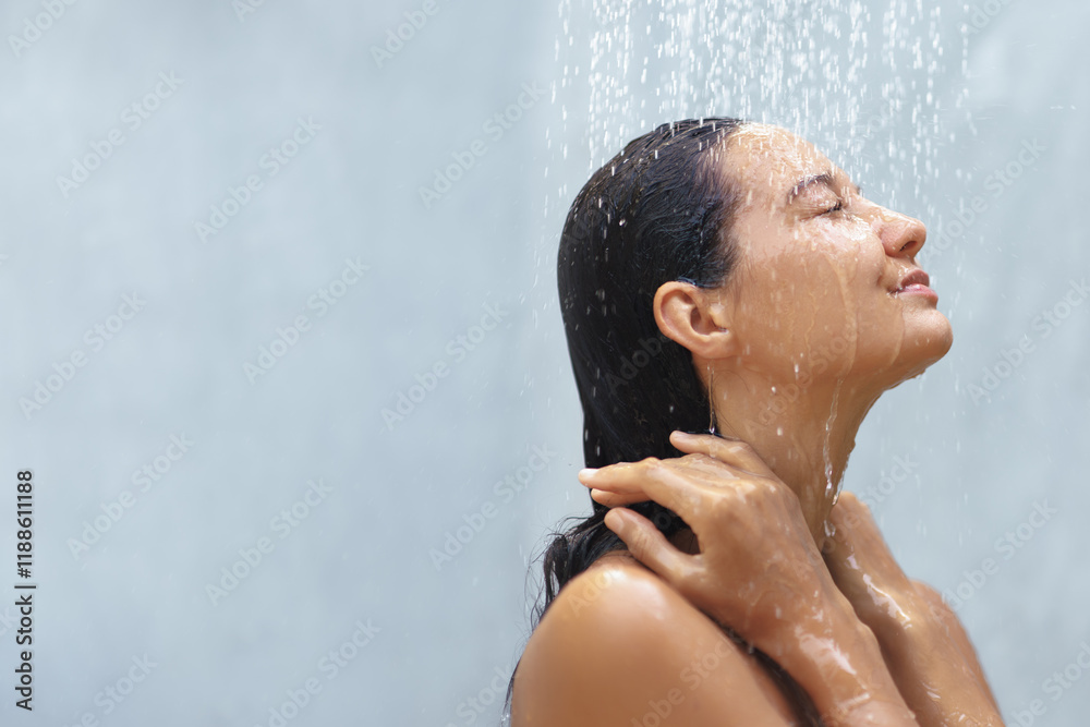 Ταπετσαρία A serene woman with closed eyes enjoys the refreshing sensation of a gentle shower, her hands resting on her neck