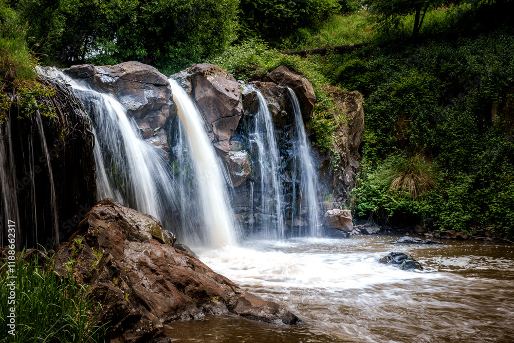 Serene Waterfall Amidst Lush Greenery Serene Waterfall Amidst Lush Greenery