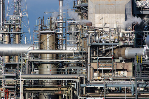 Part of refinery facility with complicated pipe system photo