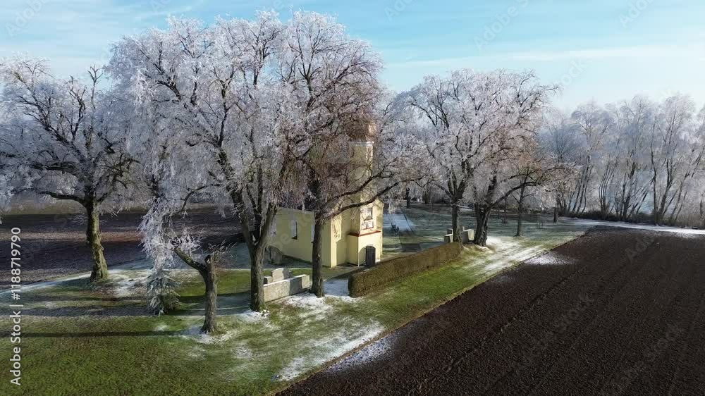 Drone winter view with frozen trees and a pond captured in flight near Sebastianikirchlein Wallersdorf, Dingolfing-Landau, Bavaria, Germany Drone winter view with frozen trees and a pond captured in flight near Sebastianikirchlein Wallersdorf, Dingolfing-Landau, Bavaria, Germany