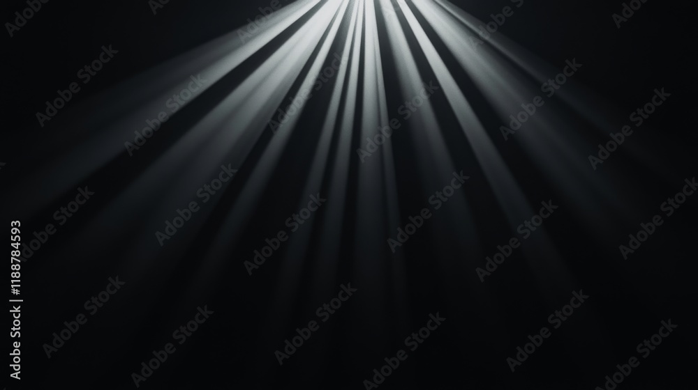 Obraz premium Bright light rays emanating from above, dark background.
