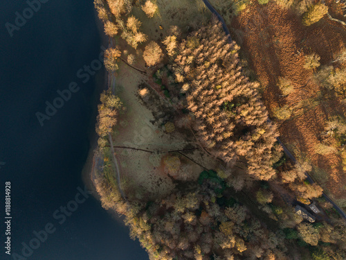 Dramatic aerial drone landscape in Autumn Winter of snowcapped mountains around Buttermere in Lake District at sunrise photo