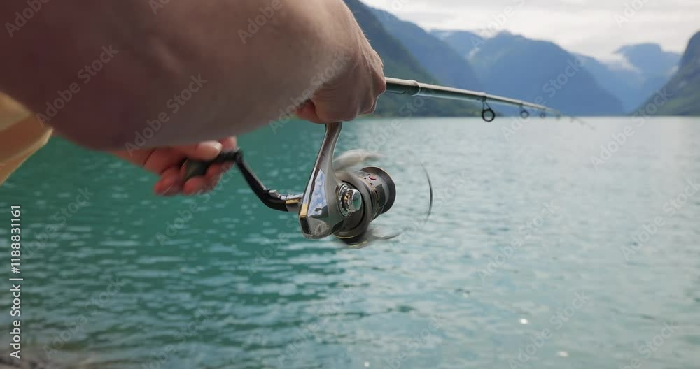 Woman fishing on Fishing rod spinning in Norway.
