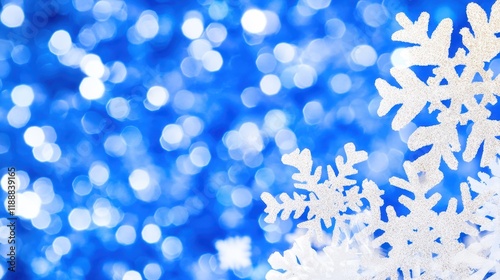 Sparkling Winter Wonderland: Festive Blue Bokeh Background with Silver Snowflakes
