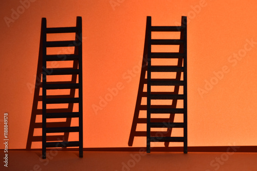 Low angle view of orange tower against sky during sunset photo