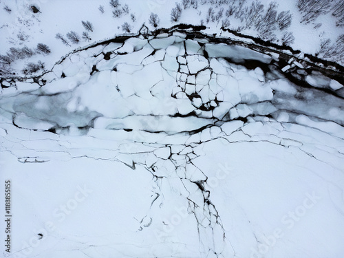 Aerial view at 90° angle of a frozen lake with ice floes photo