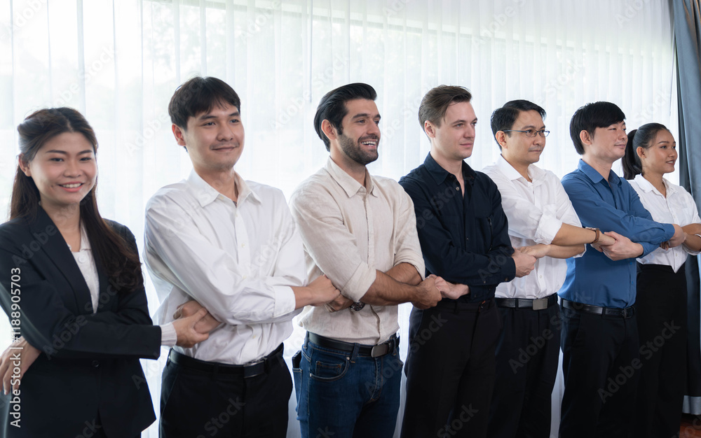 Business team standing, join and link hand together in line symbolize successful business partnership and professional synergy with diverse culture group people cooperation. Prudent Business team standing, join and link hand together in line symbolize successful business partnership and professional synergy with diverse culture group people cooperation. Prudent