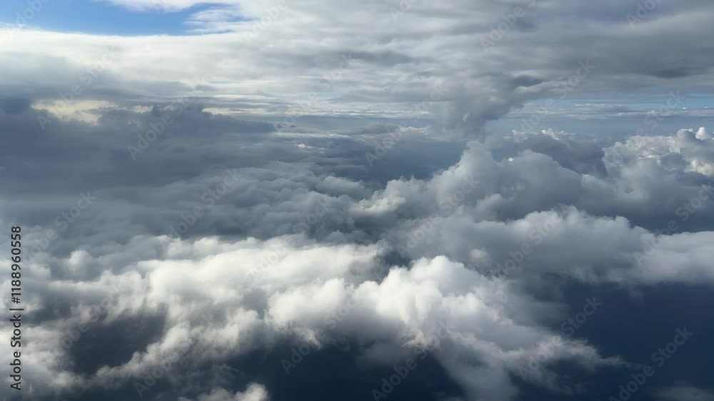 Layers of cumulus clouds, side view from an airplane window Layers of cumulus clouds, side view from an airplane window