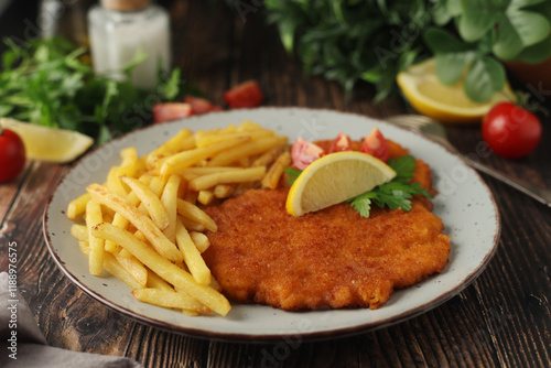 A Viennese schizel with french fries photo