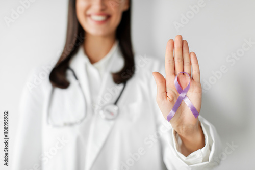 World cancer day concept. Doctor showing palm with purple ribbon for Stomach, Violence, Pancreatic, Esophageal, Testicular cancer, Alzheimer, epilepsy, lupus, Sarcoidosis and Fibromyalgia photo