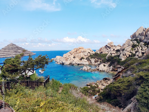 Stunning cove Cala Spinosa with granite rocks sculpted by erosion and a small hidden beach. Capo Testa in Santa Teresa Gallura, Sassari, Sardinia Island, (Sardegna), Italy. photo