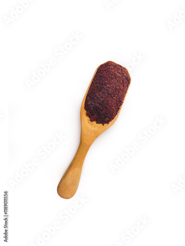 ground coffee in wooden spoon isolated on white background. top view.
