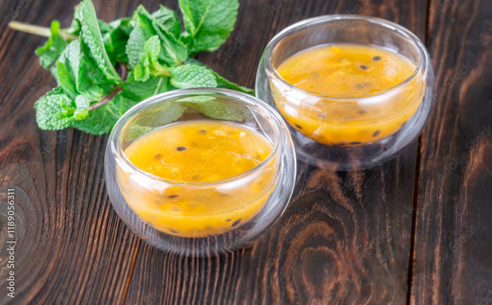 Passion Fruit Pulp in Glass Bowls on Rustic Wood Passion Fruit Pulp in Glass Bowls on Rustic Wood