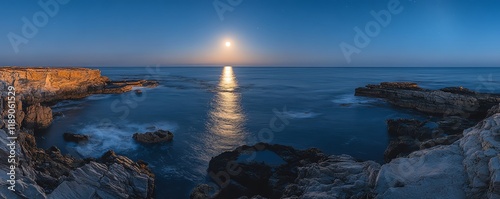 Romantic moonlight on the ocean, with the moon casting a glowing path over the sea, surrounded by calm waves and a peaceful, starfilled night sky photo