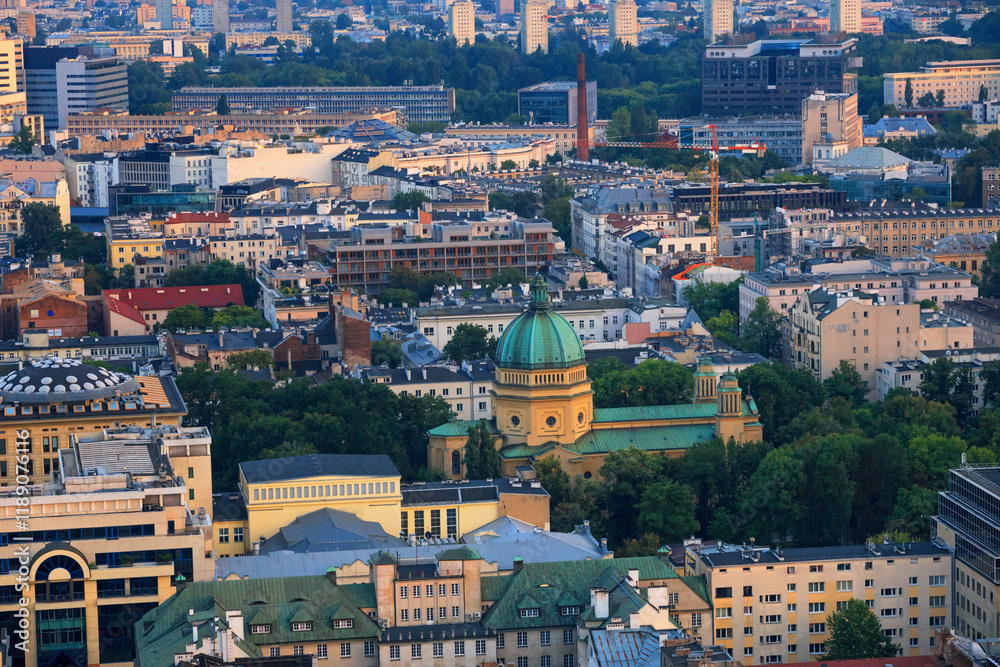 Cityscape at sunset - top view of Jerusalem Avenue and neighbourhood of Koszyki, located within the Srodmiescie district in center of Warsaw, Poland