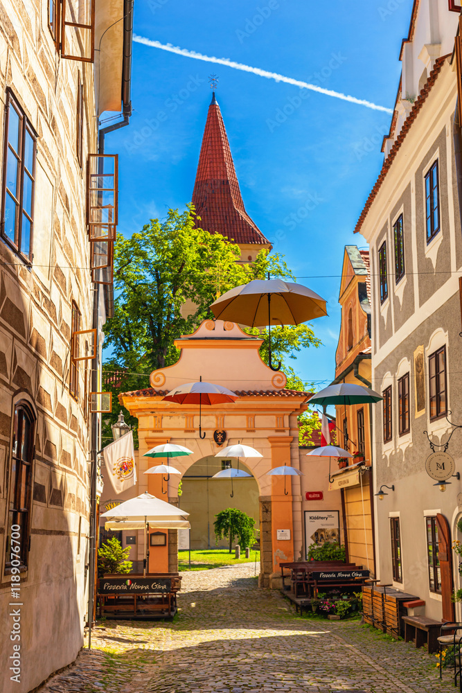 Summer cityscape - view of the entrance to the Minorite monastery in the historical center of Cesky Krumlov, Czech Republic