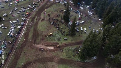 Offroad sport for racing, speed, show and entertainment. Interesting images from offroad races on challenging tracks created among pine trees. photo