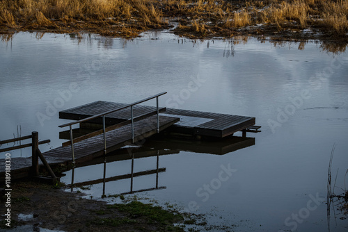 wooden footbridge on the river photo