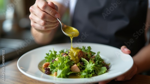 Chef Delicately Drizzling Vinaigrette on Greens