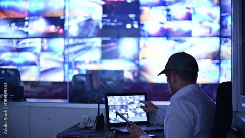 Security guards are monitoring multiple CCTV cameras and checking each one's performance.