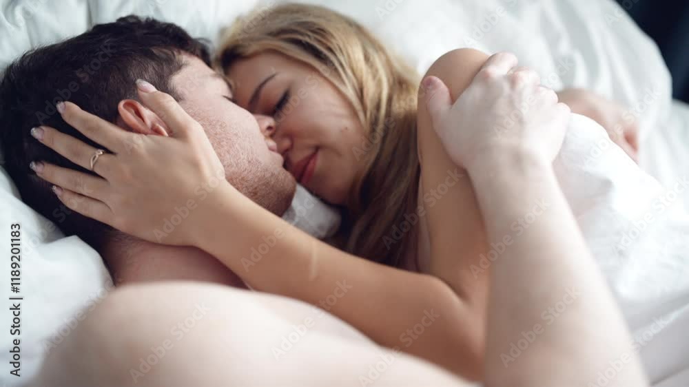 sensual couple embracing in bed. Passionate man and woman enjoying sensual foreplay. Sexy lovers kissing in bedroom in underwear. Relationship and intimate of romantic lovers, sexual activity in happy sensual couple embracing in bed. Passionate man and woman enjoying sensual foreplay. Sexy lovers kissing in bedroom in underwear. Relationship and intimate of romantic lovers, sexual activity in happy