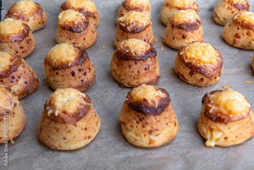 Pogaca stuffed with cheese. A full tray of fresh Pogaca traditional Eastern European salty buns with cheese - Pogace. photo