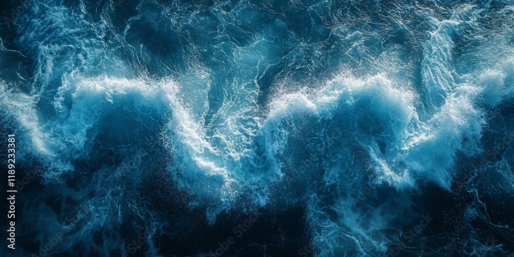 Obraz premium Dramatic ocean waves captured in motion with a deep blue hue