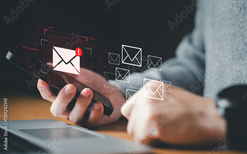 Business man using smartphone and computer that show warning sign after got attack phishing email by malware from hacker that commit cyber crime or software crash to cause an error. photo