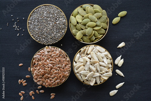 seeds rich in unsaturated fatty acids in brass bowls
