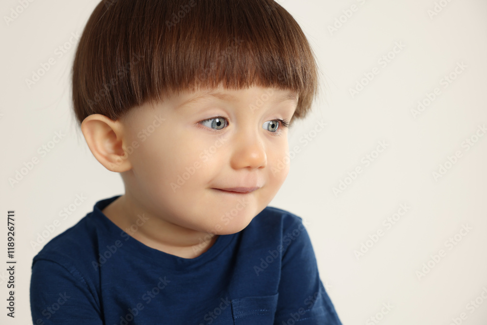 Portrait of cute little boy on light grey background. Space for text Portrait of cute little boy on light grey background. Space for text