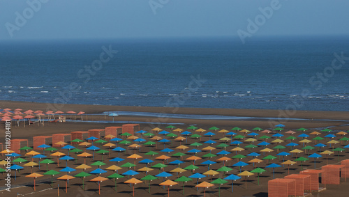 colorful beach umbrellas on the Caspian Sea, no people photo