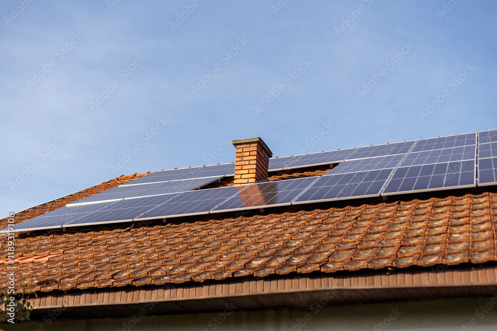 Solar panels installed on a roof enhance energy efficiency in a sunny neighborhood Solar panels installed on a roof enhance energy efficiency in a sunny neighborhood
