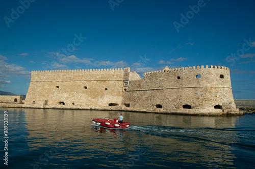Venetian stone Koules Fortress and entrance old port of Heraklion, Crete, Greece photo