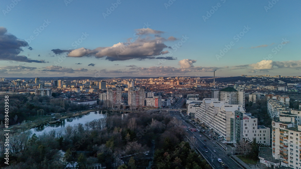 Obraz premium Expansive Cityscape Under Vibrant Clouds