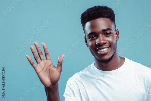 A person standing with his hand raised, possibly waiting for something or signaling attention photo