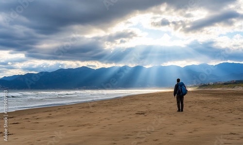 Lone hiker beach sunset mountains hope