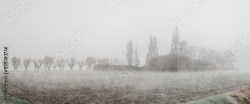 Rural house in the fog in the lower Po Valley; Mdicina municipality, Bologna Metropolitan city, Emilia-Romagna, Italy.