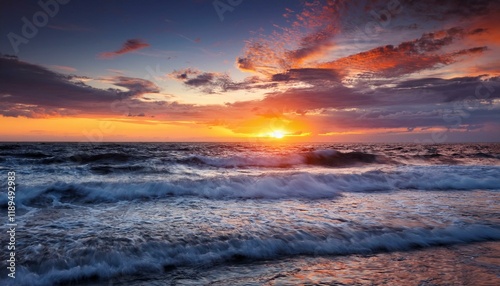dramatic sunset over turbulent ocean waves with vibrant clouds