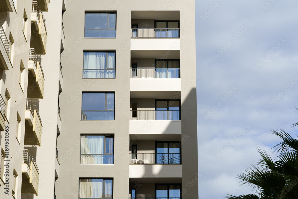 Modern apartment building in Mediterranean style in Albania on the sea coast. Concept of selling a house abroad, renting apartments Modern apartment building in Mediterranean style in Albania on the sea coast. Concept of selling a house abroad, renting apartments