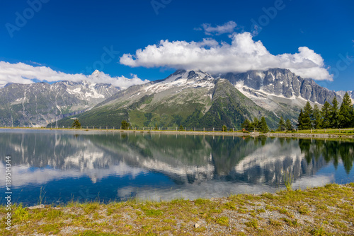Lake in the Alps. Beautiful clear turquoise water lake in Chamonix Mont Blanc valley in French Alps. Alpine beautiful scenery in summer with blue sky